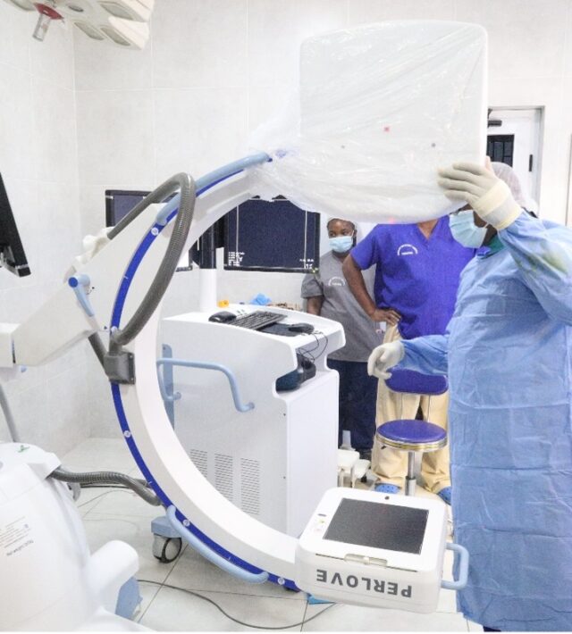 Members of our theatre team prepare the new C-arm fluoroscopy system for image-guided orthopaedic surgery